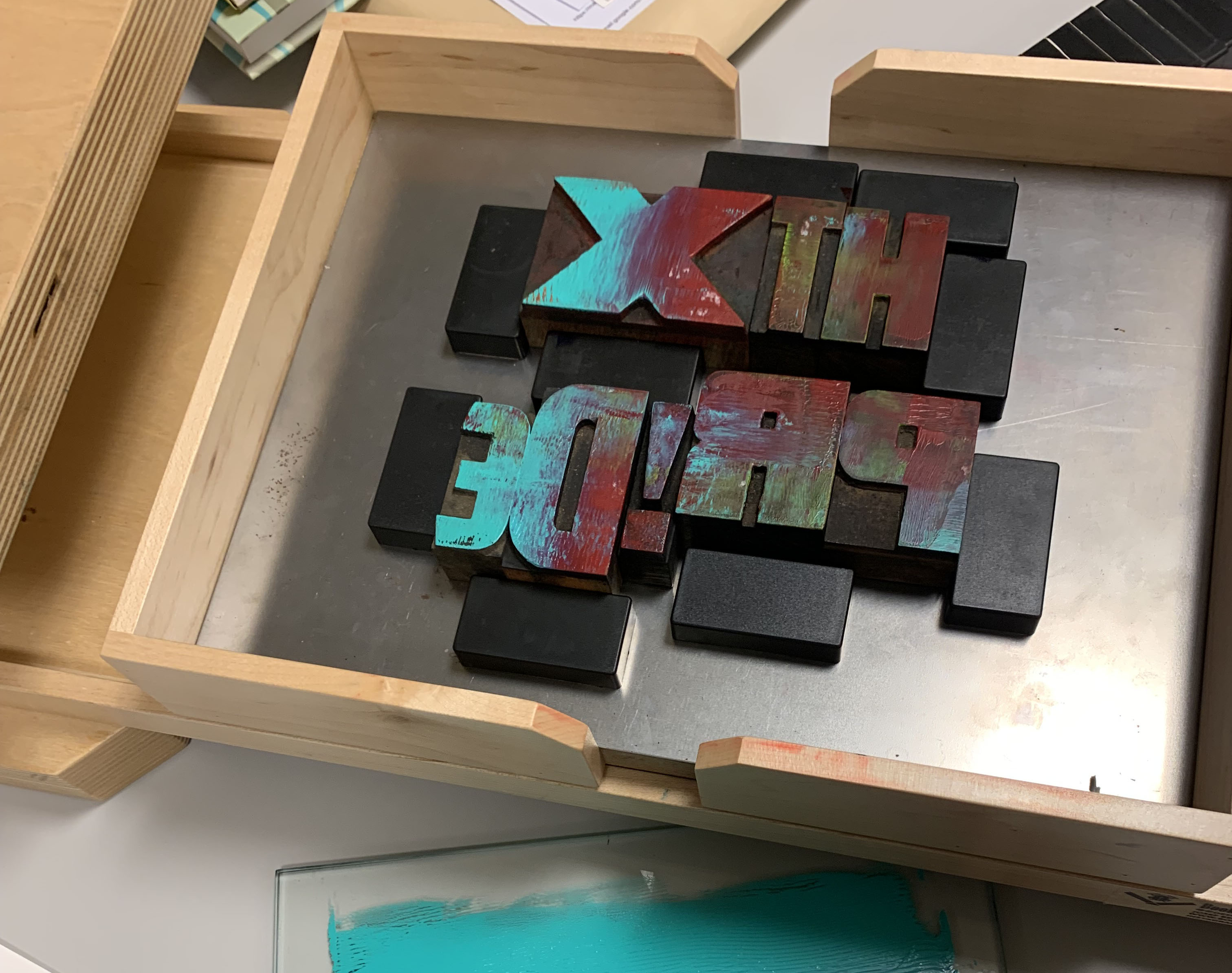 image of inked type on a metal base for printing