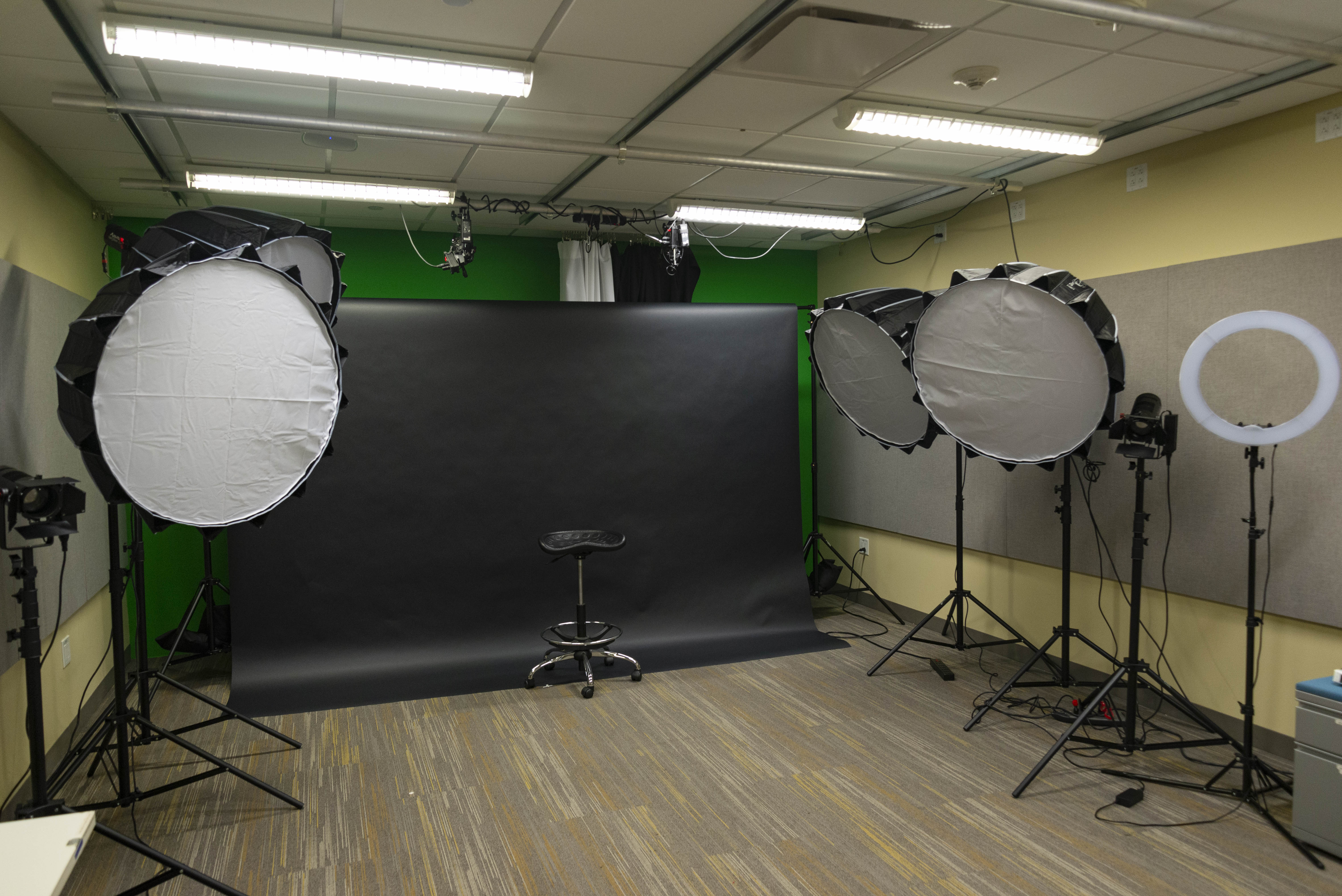 view of photo studio with all lights and backdrops