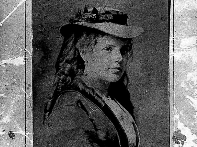 Old photograph of a woman in a hat