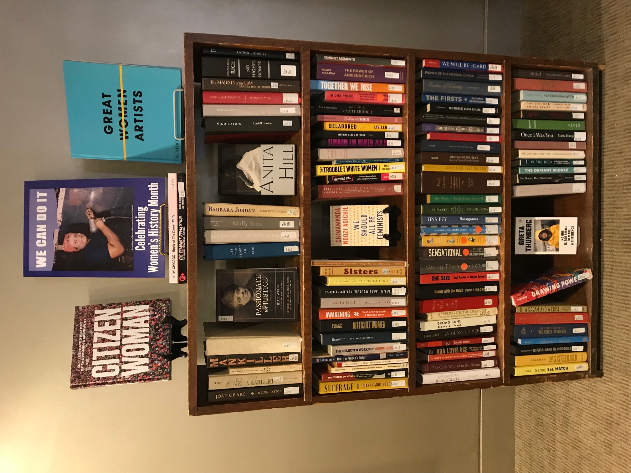 bookshelf of women's history books