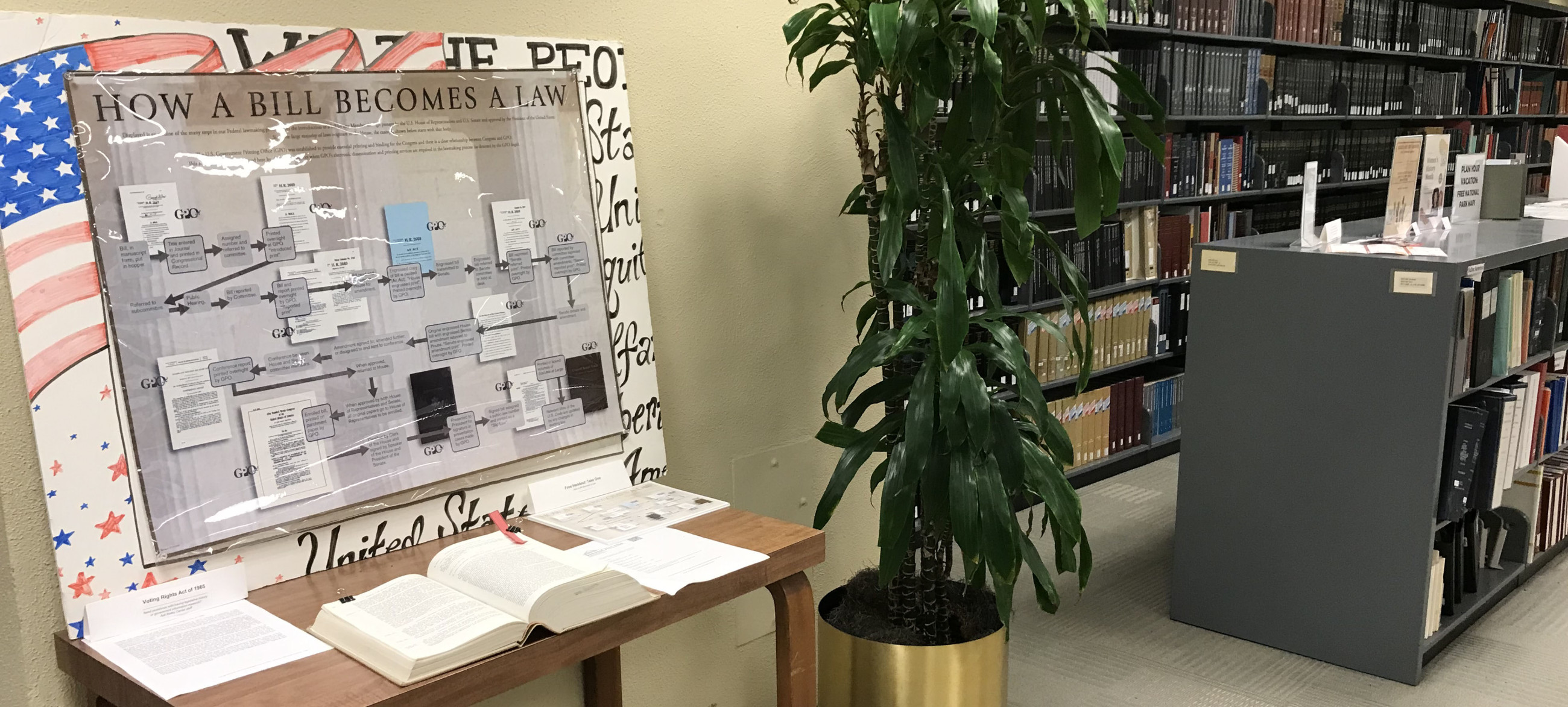 Kelley Center reference shelves and display on how a bill becomes a law