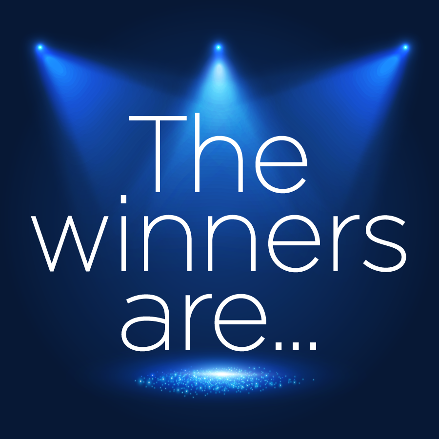 Spotlights on a stage with the words, &quot;The winners are...&quot;