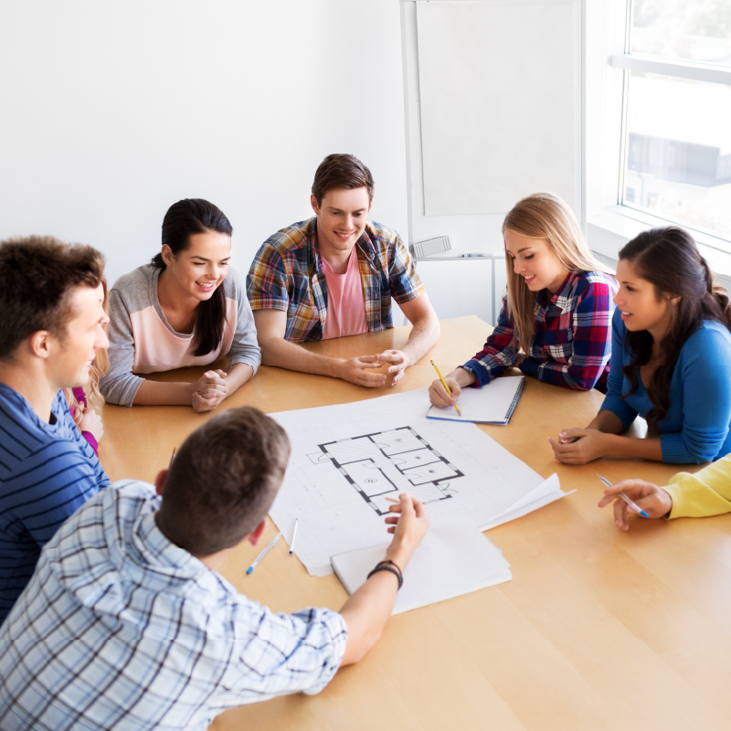 students surrounding a floor plan