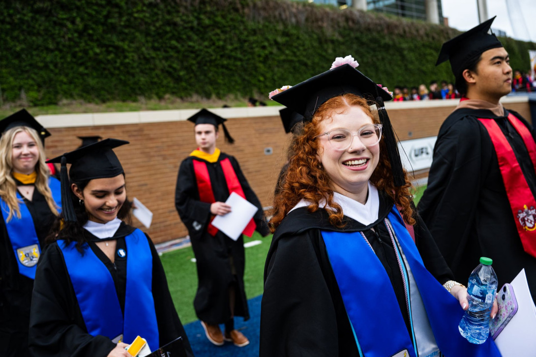 Rice students in graduation gowns and hats